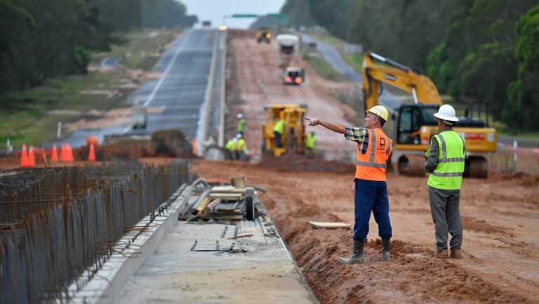 Why is the Bruce Highway upgrade north of Brisbane falling further behind schedule?